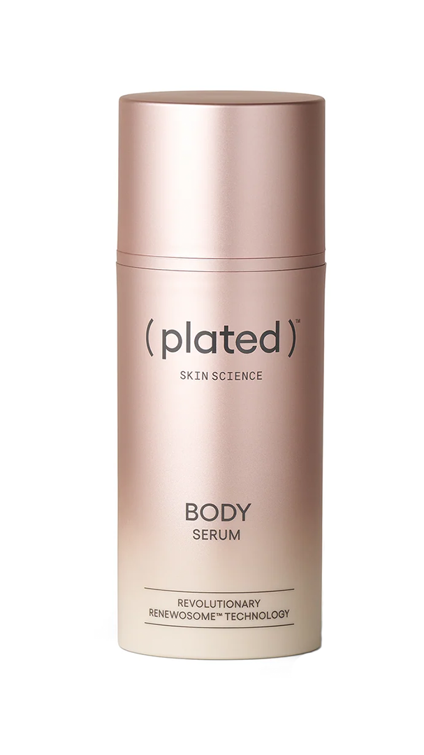 A rose gold bottle labeled plated BODY Serum, featuring REVOLUTIONARY RENEWOSOME TECHNOLOGY at the bottom, stands upright against a white background.